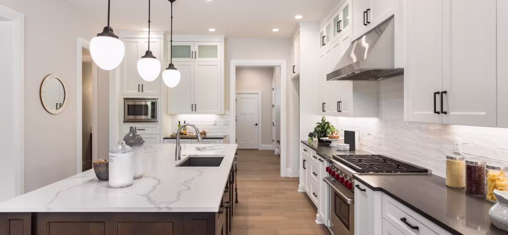 Transitional kitchen remodel in Largo, FL, Pinellas County, with white shaker cabinets, quartz countertops, and stainless steel appliances.