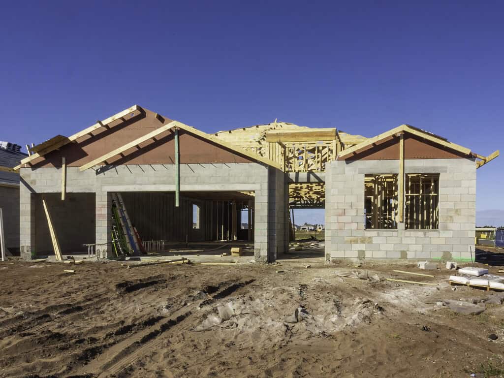 New home construction in St. Petersburg with block walls and framing underway