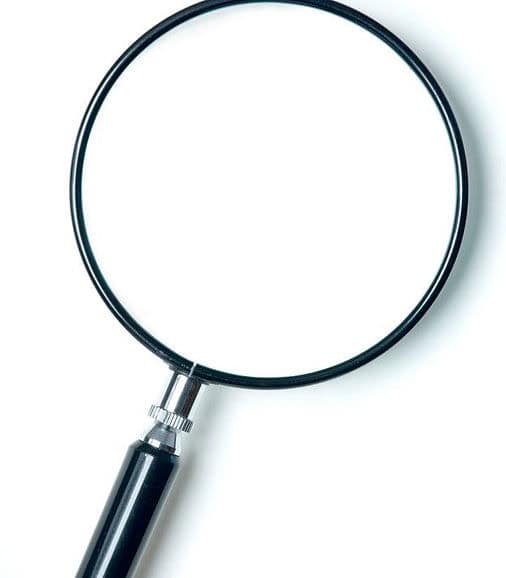 Magnifying glass representing preconstruction research and feasibility studies for home builds, additions, and ADU in Tampa, FL, Hillsborough County, and St. Petersburg, FL, Pinellas County.
